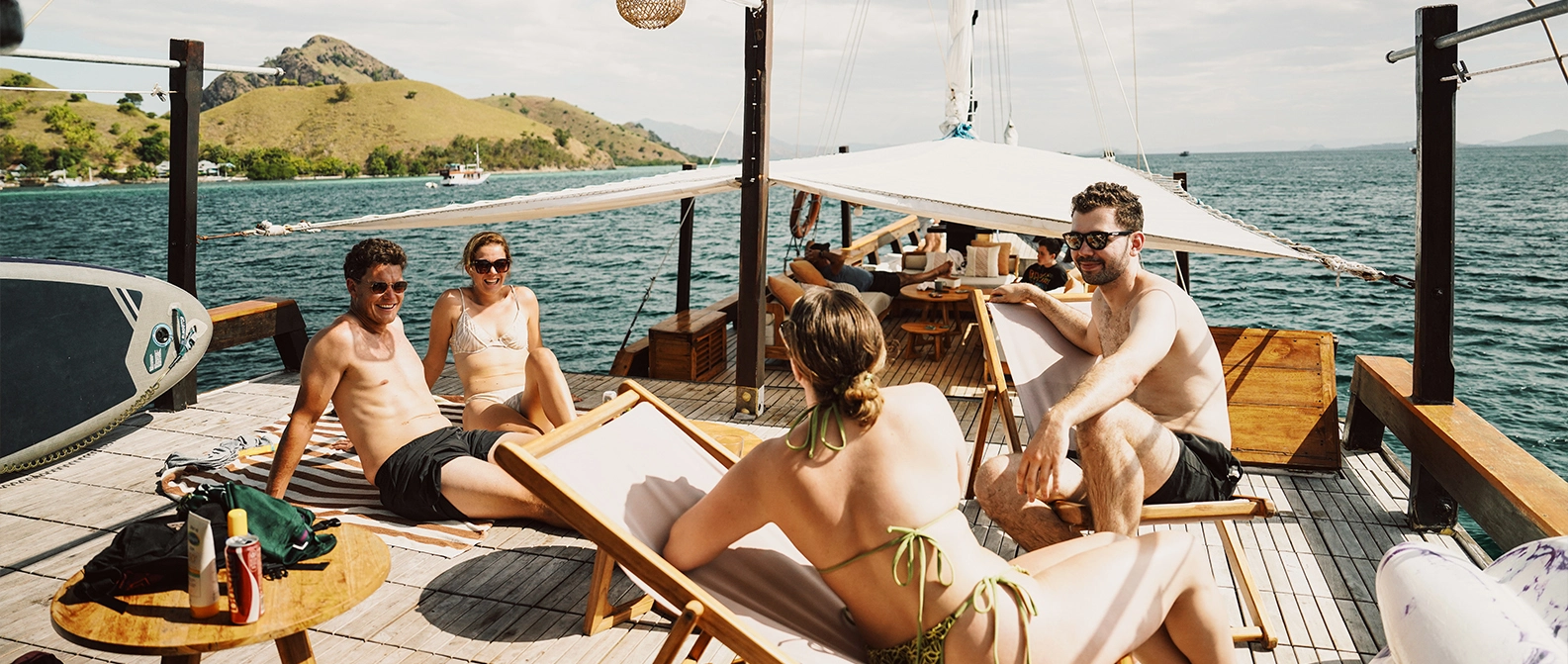 ourists boarding a Komodo sailing boat at Labuan Bajo harbor